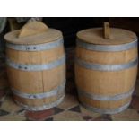 A pair of coopered oak and galvanised steel banded flower barrels complete with lids together with a