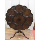 A Georgian mahogany supper table of eight settings with further carved detail raised on a turned