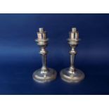A good quality pair of silver plated storm lantern bases with turned columns and stepped circular
