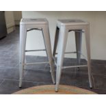 A set of four light grey painted steel stacking bar/breakfast stools with pierced square and rounded