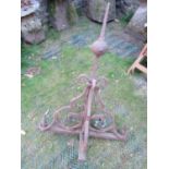 A 19th century wrought iron finial with pointed spire, scrolled and foliate detail, together with