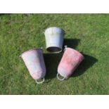 Two vintage galvanised fire buckets with loose loop handles, pot riveted seams, remains of painted