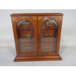 Good quality Sheriton style mahogany smokers cabinet, the top inlaid with boxwood companion urns