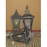 A pair of Victorian style exterior post lanterns of square tapered form with glazed and perspex