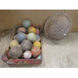A collection of mainly croquet balls and a few carpet examples together with an old helmet (AF)