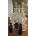 A mixed collection of glassware comprising three pairs of decanters, further decanter, pair of cup