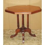 A Victorian walnut occasional/centre table of octagonal form raised on turned and swept supports