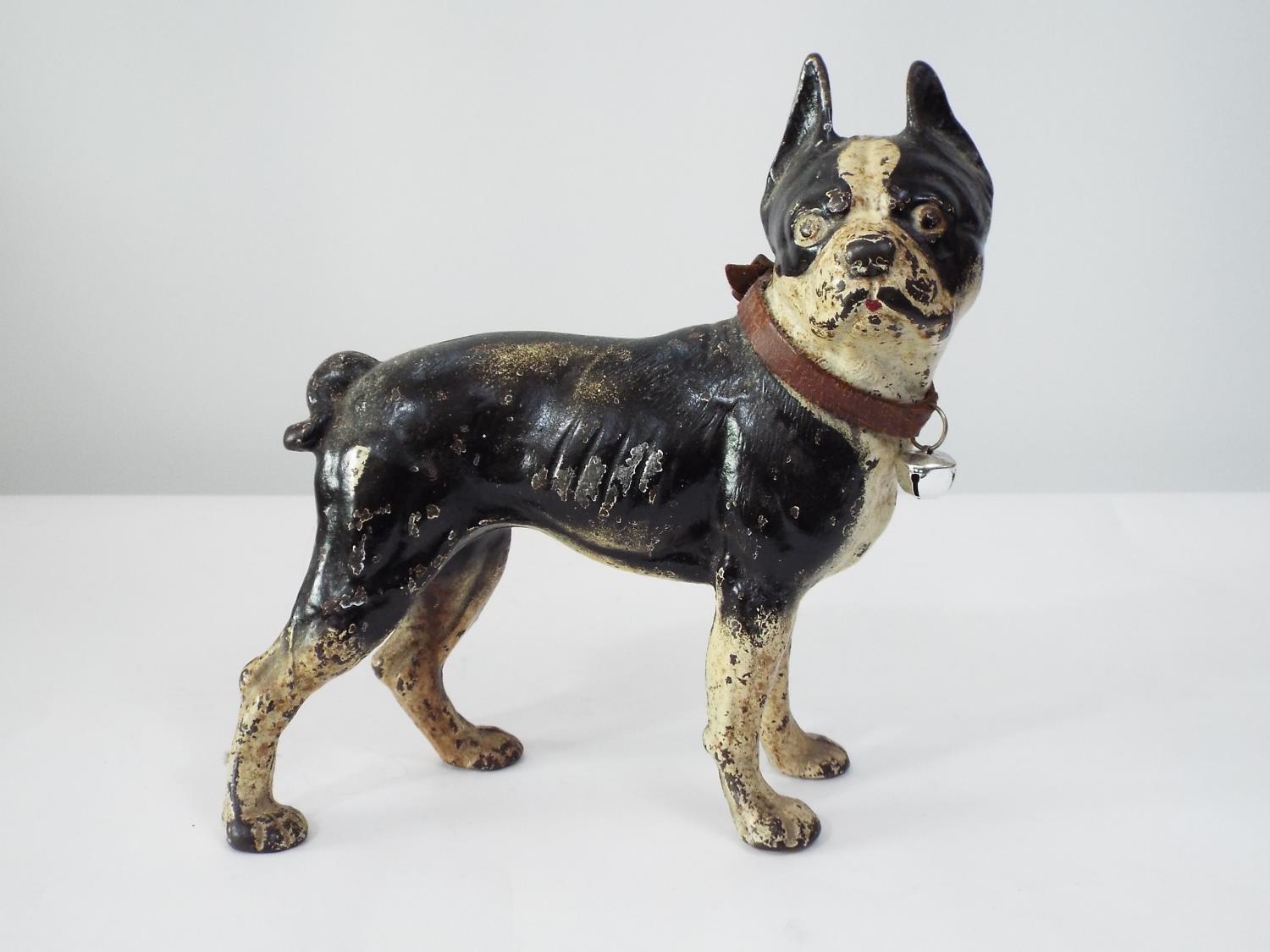 A late 19th century cast iron figure of a standing Bulldog, with original black and white painted