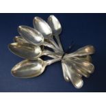 Set of eight Georgian silver fiddle and thread dessert spoons, maker William Eley & William Fearn,