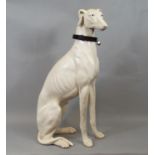 A resin figure of a seated Whippet, 53 cm