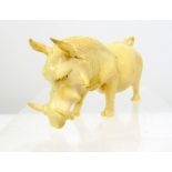 Early 20th century ivory carving of a warthog, standing with head down, 9cm