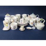 A collection of ceramics by Rachel Miles with decoration from Alice in Wonderland including four