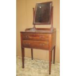 A small Edwardian mahogany dressing table in the Georgian style, the rectangular swing mirror with