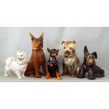 A collection of five dogs including an Italian pottery figure of a Pomeranian, Scottie Dog, etc,