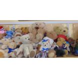 A extensive collection of mixed teddy bears, some Woodrow Bears, including one in a sailors