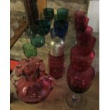 A collection of antique coloured glasses and goblets to include six cranberry, two blue, seven green