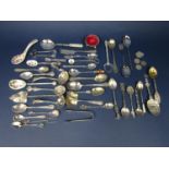 Seven novelty continental white metal souvenir spoons together with a box containing a collection of