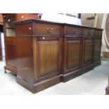 A good quality reproduction mahogany shallow breakfront sideboard in the Georgian style fitted