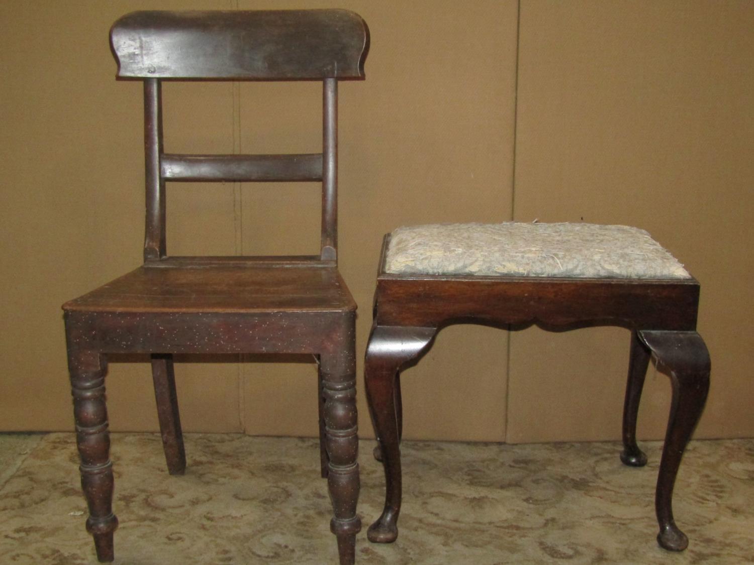 A Queen Anne style dressing stool of rectangular form with drop in upholstered seats raised on