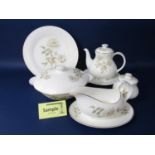 A collection of Royal Doulton Rose pattern wares H5050 comprising a pair of tureens and covers, a
