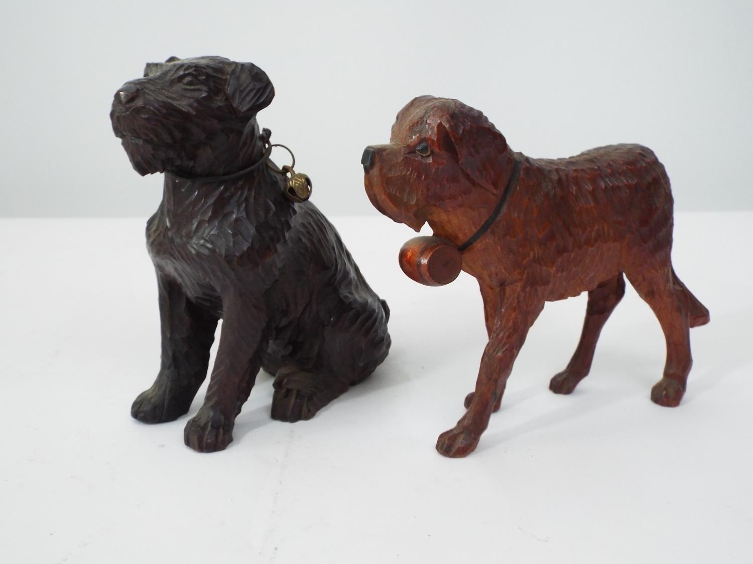 Two Austrian carved softwood models of dogs, one a St Bernard, 16cm max