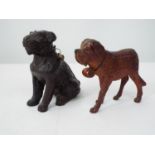 Two Austrian carved softwood models of dogs, one a St Bernard, 16cm max