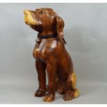A solid carved hardwood figure of a hound with plaited leather collar, 50 cm high