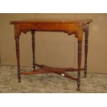An inlaid Edwardian occasional table of rectangular form with bleached top raised on four slender