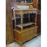 A Victorian style stripped pine washstand with transfer printed tiled splashback and turned supports