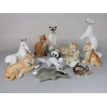 A collection of USSR model animals including lion cubs, raccoon, recumbent foal, badger, etc (11)