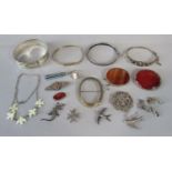 Collection of antique silver / white metal jewellery to include four bangles, two polished agate