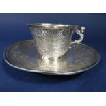 Good quality continental, probably German, silver cup and saucer, embossed and engraved with various