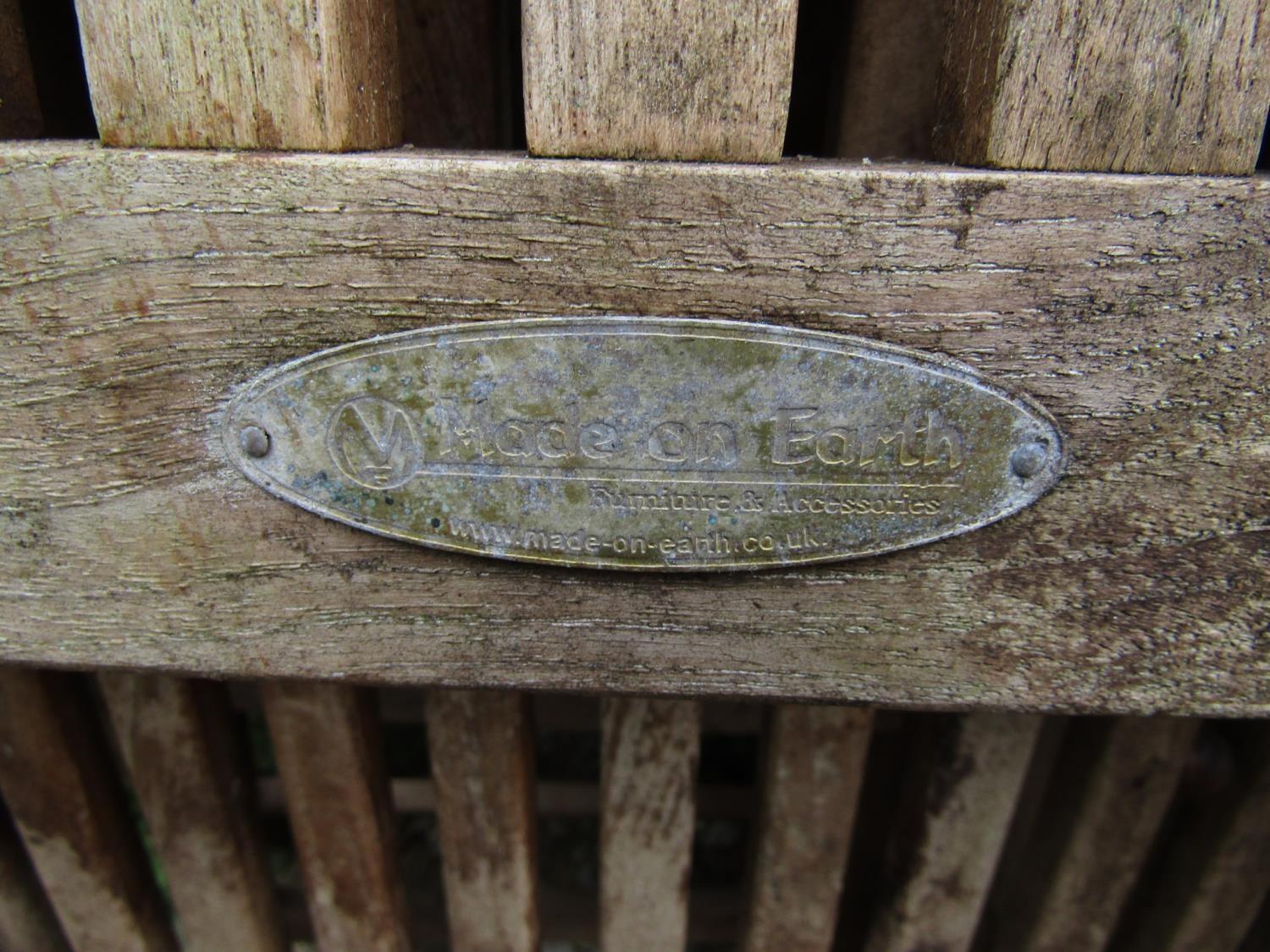 A set of eight weathered teak folding garden chairs with slatted seats and backs with oval labels to - Image 2 of 2