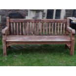 A Lindsey substantial teak garden bench with slatted seat and back 180 cm long