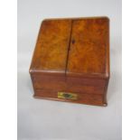 19th century burr walnut stationery cabinet, the slope top with two hinged doors enclosing a