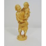 Taisho Period - Ivory Okimono of an old man carving a wicker basket and a small child, with a sack
