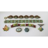 Collection of enamelled silver jewellery comprising two bracelets with floral decoration in