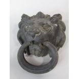 Good quality cast metal lion head door knocker with faceted ring handle