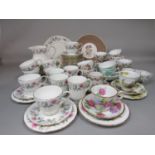 A collection of decorative floral tea wares including Duchess Bramble Rose pattern examples, Queen