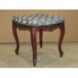 A 19th century stool, the upholstered seat with serpentine outline, acanthus detail and cabriole