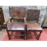A set of six (4+2) Cromwellian style oak framed dining chairs, with hide upholstered seats and