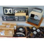 A collection of vintage cinema items to include film reels, projector, a Dolby sign, etc (a