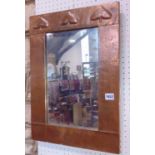 Good Arts & Crafts copper wall mirror in the manner of Archibald Knox, the riveted copper frame with