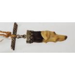 A 19th century bar brooch, carved in ivory in the form of a hounds head with metallic mounts