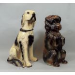 A late Victorian terrier with glass eyes, in upright pose, together with a further pottery figure of