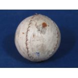 An old hand-stitched golf ball with vellum casing