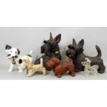 Two studio pottery figures of Scots Terriers by Joanna Cooke, and four further Scots Terriers in