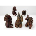 Japanese carved timber models of monkeys, one in ceremonial dress, 12cm max