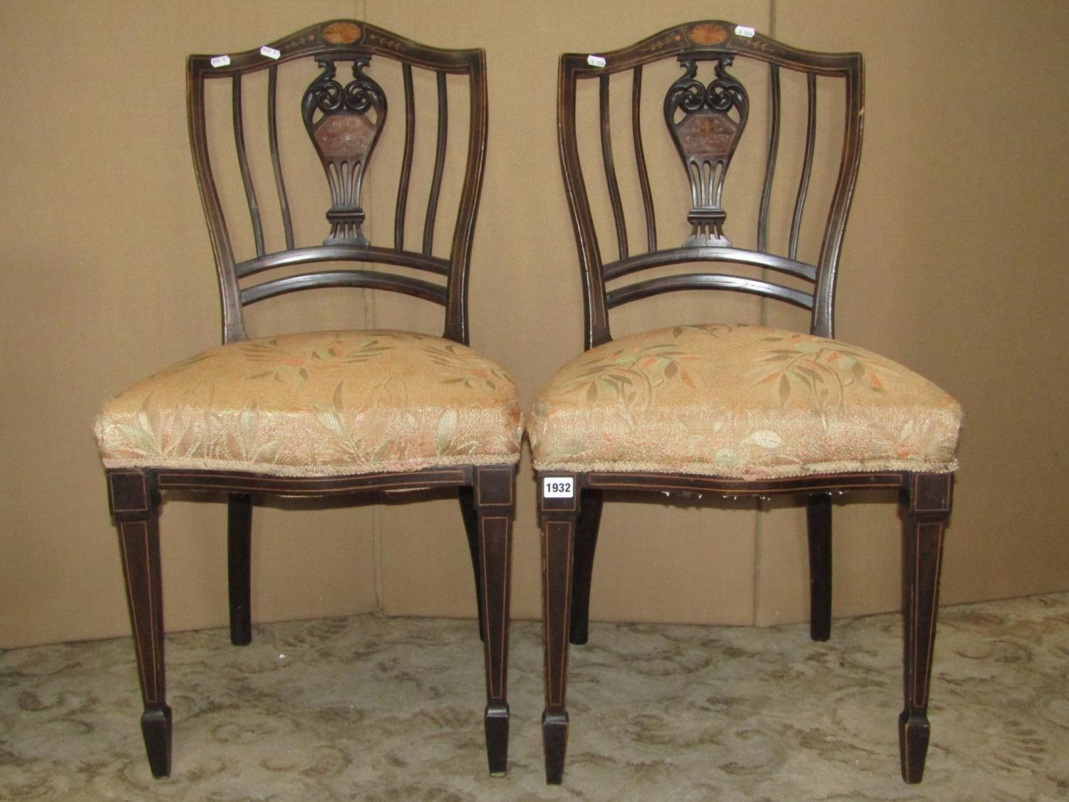 A pair of Edwardian occasional chairs with inlaid detail and shield shaped backs with pierced vase