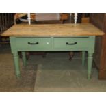 A 19th century pine farmhouse kitchen table with later green painted finish and fitted with two